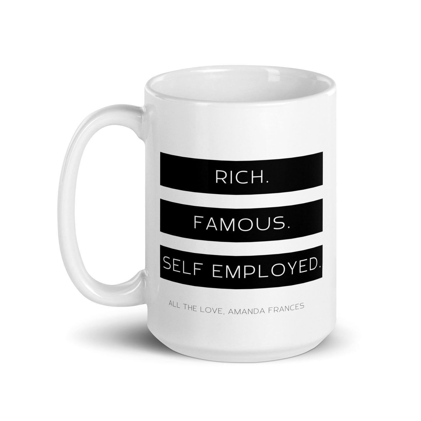 White coffee mug with the text: Rich. Famous. Self-Employed and All the love, Amanda Frances