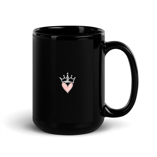 Black mug with a pink heart and crown design on a white background