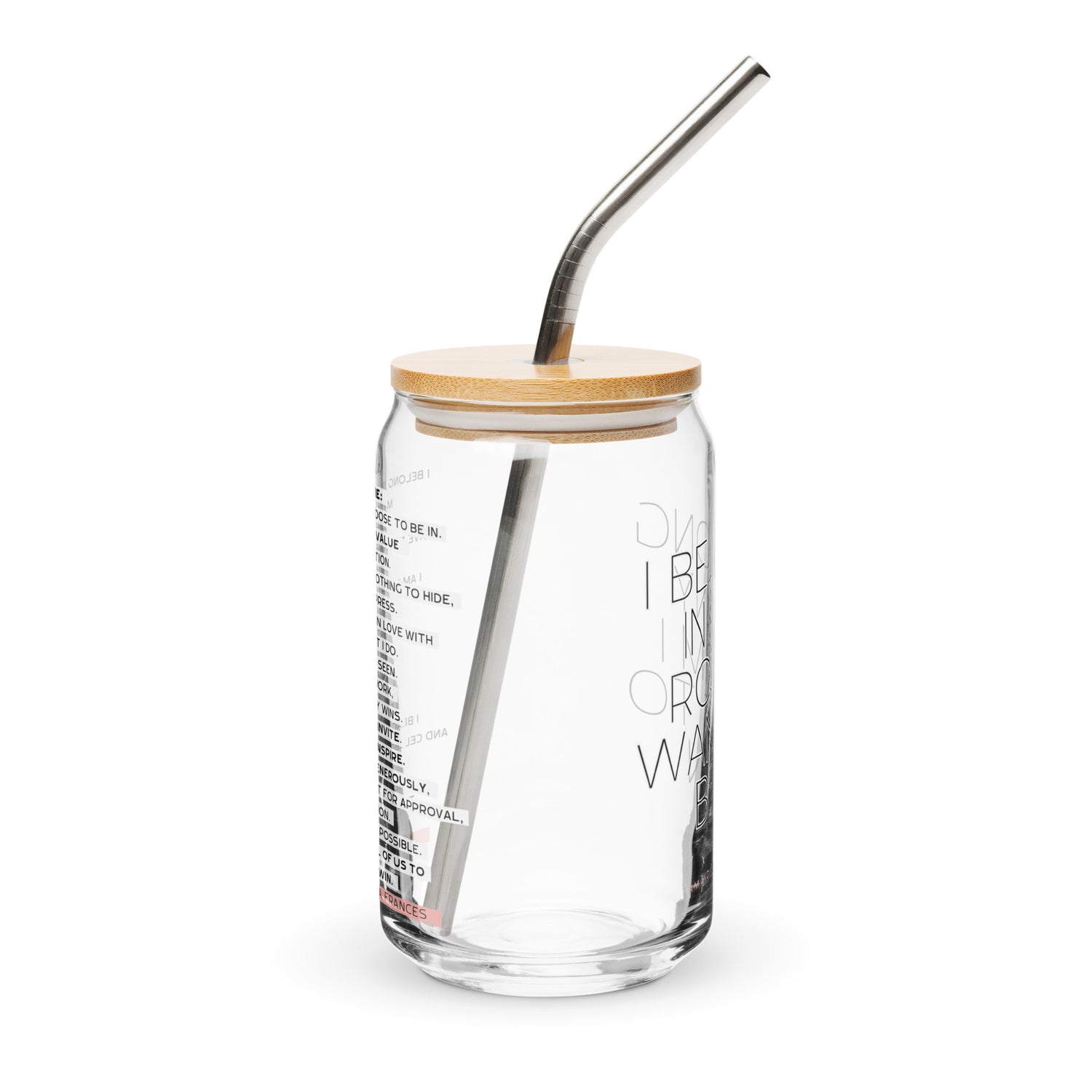 Glass tumbler with straw and wooden lid on a white background. The text says: I belong in any room I want to be in.