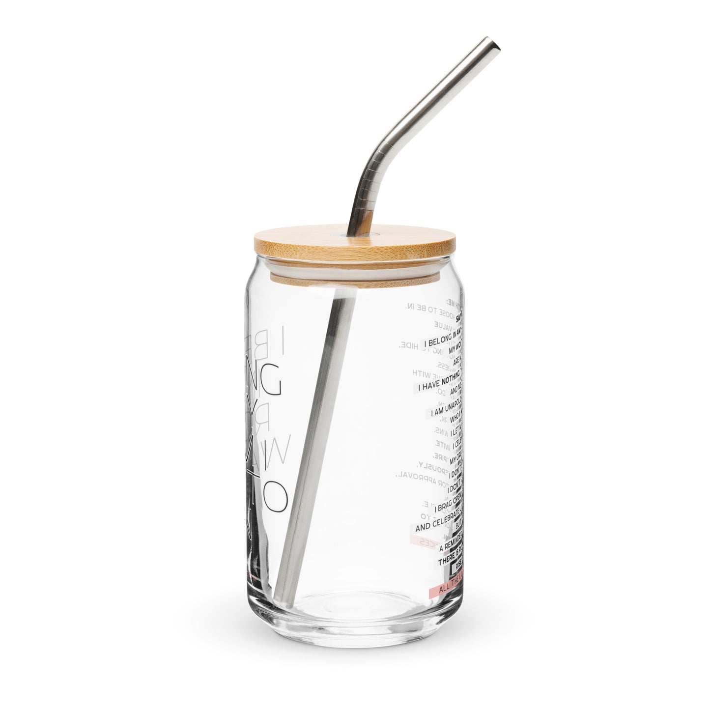 Glass tumbler with straw and wooden lid on a white background. The text says: I belong in any room I want to be in.